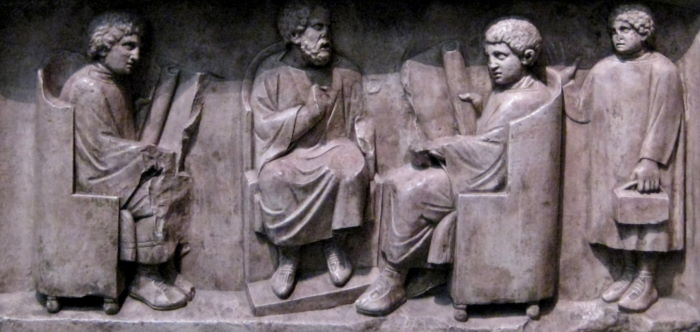 Scena scolastica.  Bassorilievo di Treviri del II secolo d.C
